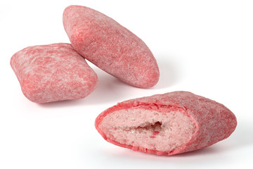 Two and a half pads of pink strawberry chewing gum on a white background