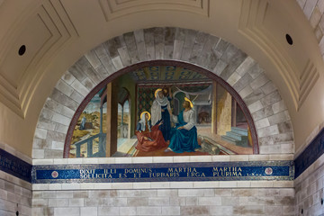 Bethany, Betania, Israel January 31, 2020: Church in Bethany in commemorating the home of Mari, Martha and Lazarus, Jesus' friends as well as the tomb of Lazarus.  Colorful mosaic in the church