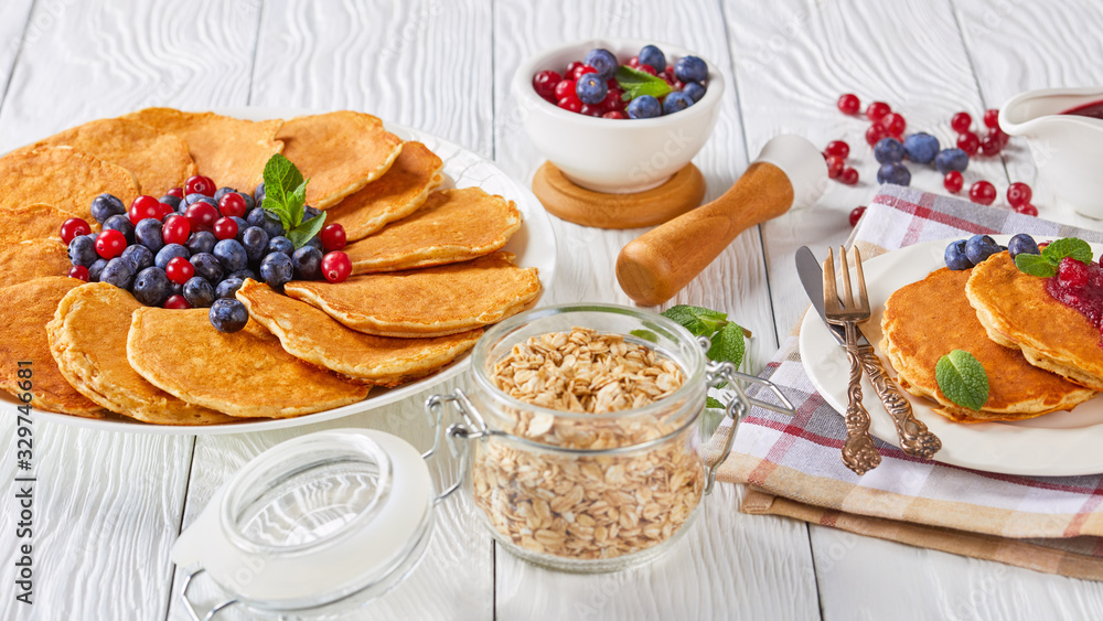 Wall mural oatmeal pancakes on a white plate with berries