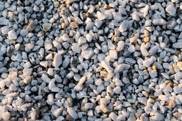 Stones background in sunlight rays