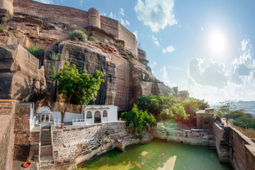 Hindu temple with a lake under the walls of Mehrangarh Fort Jodhpur, India