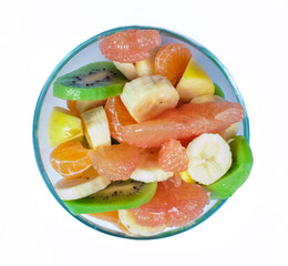 Fruit salad with citrus in a glass bowl