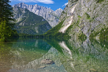 Fototapeta na wymiar lake Obersee with reflections and view to the alps