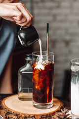 coffee ice cubes with milk on wood table