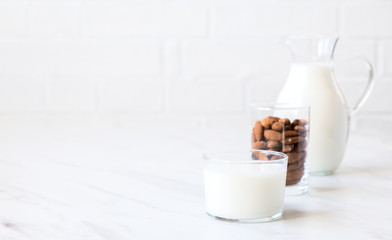 Almond milk in a glass jug .Drink for vegetarians.