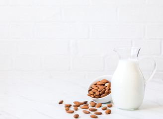 Almond milk in a glass jug .Drink for vegetarians.