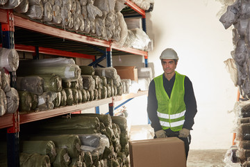 Warehouse worker as a packager with a package
