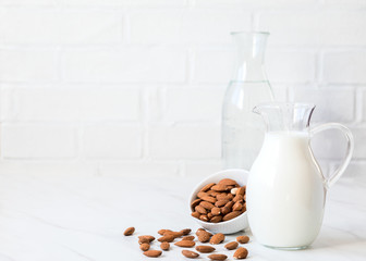 Almond milk in a glass jug .Drink for vegetarians.