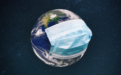 The planet earth is wearing a protective mask in the space. Concept of quarantine, protection from viruses and pandemic. Elements of this image furnished by NASA