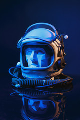 Gypsum head inside military aviation helmet on a black background
