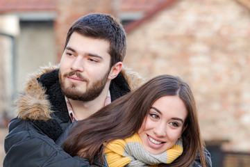 Young couple enjoying outdoors in urban surroundings.