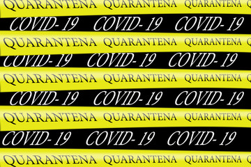 Security Quarantine Cordon Tapes with the text" Quarantine" in italian language- Quarantena. Coronavirus in Italy.