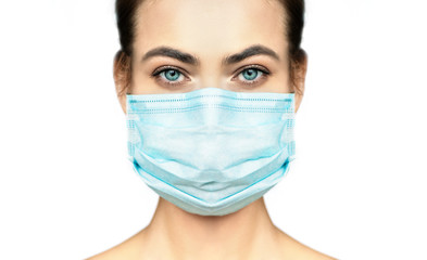 Cropped image of beautiful woman in protection medical mask.