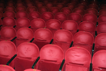 Naklejka premium Classic rows of empty reddish seats in theatre