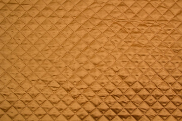 Fabric velour quilted close-up. Quilted surface upholstery