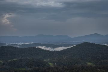 Obraz na płótnie Canvas Misty mountains range with amazing sky