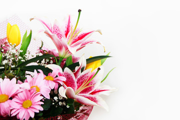 festive multi-colored bouquet of natural pink lilies, chrysanthemums and yellow a tulips