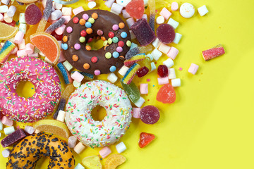 A lot of colorful candy. Tasty appetizing Party Accessories Happy Birthday Sweet Treat Swirl Candy Lollypop on Bright Background Flat Lay