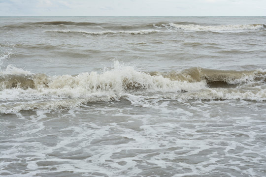 Roaring sea and dark raint clouds