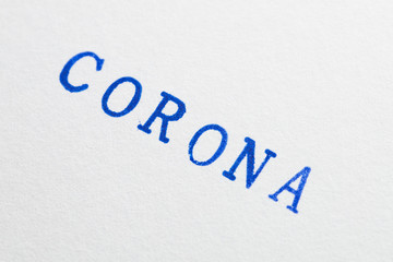 a corona word stamped on a piece of paper.