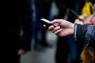 Press conference with media microphones held in front of business man, spokesman or politician