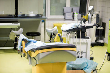 Gynecological surgery room with chair and equipment in Reproductive medicine Clinic. Selective focus, artificial insemination operating room
