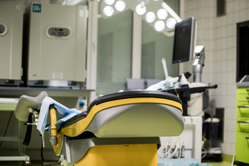 Gynecological surgery room with chair and equipment in Reproductive medicine Clinic. Selective focus, artificial insemination operating room