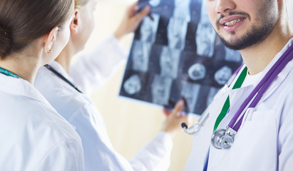 Medical doctors analysing x-ray photography in hospital