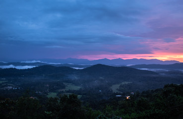 Obraz premium Misty mountains range with amazing sky