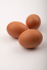 Chicken eggs on a white background. Close up.