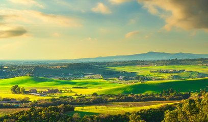 Obraz premium Sunset landscape in Maremma. Rolling hills and cypress trees. Bibbona,Tuscany, Italy