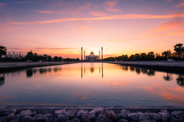 Central Mosque of Songkhla Province, Thailand, with reflection in pond and beautiful sunset twilight sky.