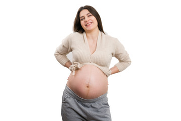 Young laughing pregnant woman showing her tummy
