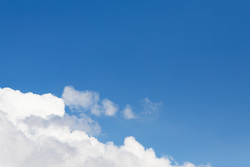 Beautiful white soft fluffy cloud on a clear blue sky background
