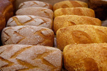 loaves of bread on a shelf or display case in a store