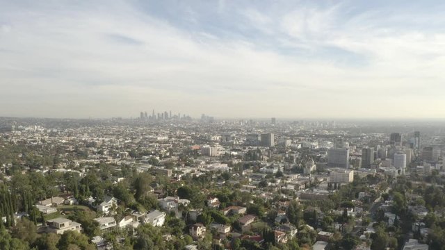 4K flight over the Hollywood Hills with the downtown Los Angeles skyline in the background.