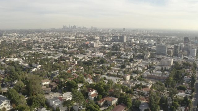 4K flight over the Hollywood Hills with downtown Hollywood and the Los Angeles skyline in the background.