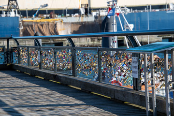 A picture of many love padlocks attaching to the fence.  Vancouver BC Canada