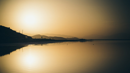 Sunset over the coast of Maharloo pink lake, Shiraz, Iran