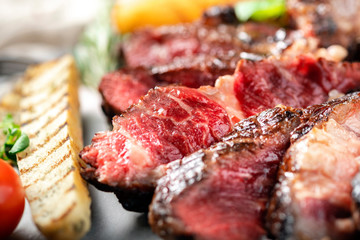 Grilled roast beef steak rare cut into pieces