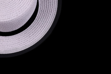 Fototapeta na wymiar white hat on black background