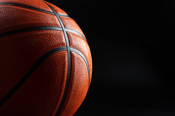 Basketball ball close up on dark black background. Basketball concept
