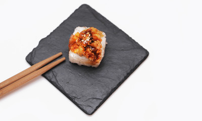 Japanese roll on stone background.