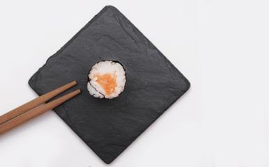 Japanese roll on stone background.