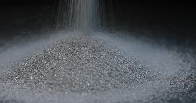 Silver mining, sprinkle fraction of rare metal on black background