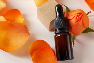 Cosmetics containers decorated with orange rose petals