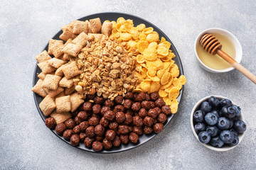 Set of dry cereal flakes for Breakfast with milk and berries. Healthy natural food.