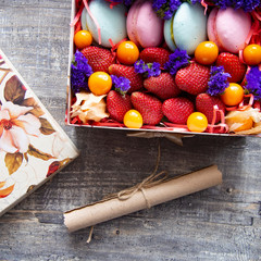 gift box with berries and macaroons