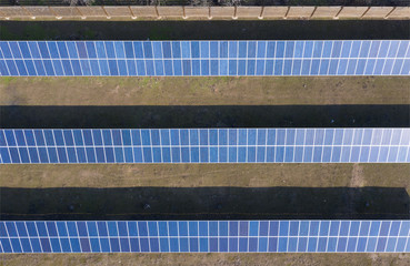 Blue panels of solar power plant in the backyard. Energy independence.