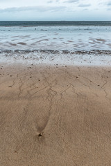 Water streaks in sand